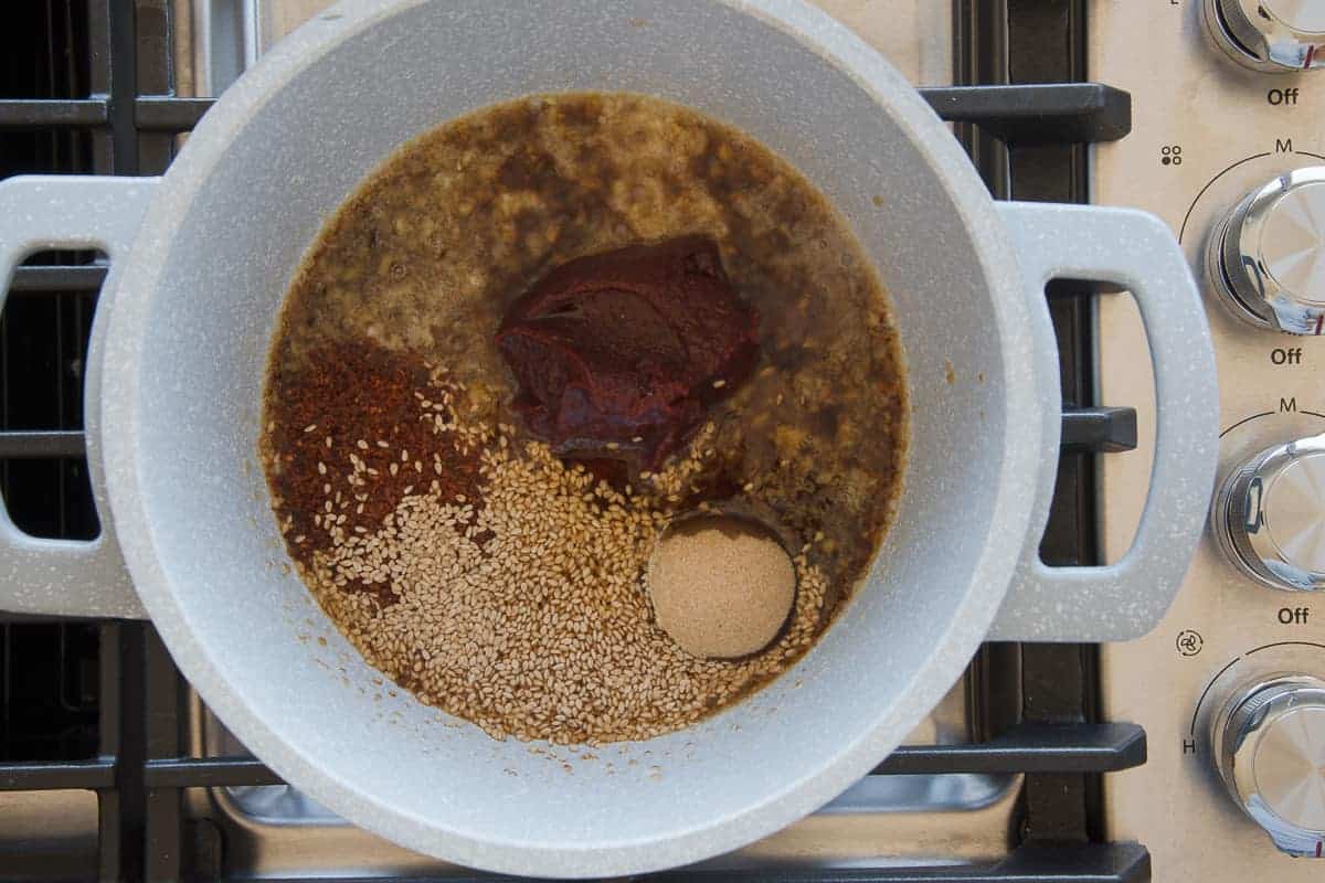 The remaining ingredients for the sauce are added to the pot. 