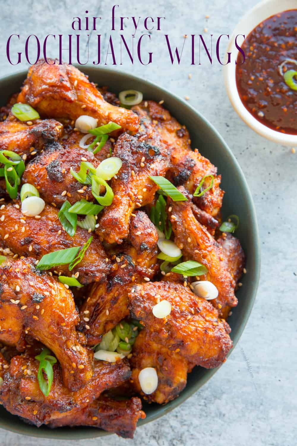 Gochujang Chicken Wings made in the Air Fryer are simple and tasty. Make your next batch with this Korean red pepper condiment and level up your wing game. #chickenwings #airfryerrecipes #chickenwingrecipe #wings #chickenrecipe #gamedayrecipe #gochujang #Koreanchickenwings #Koreanrecipes via @ediblesense