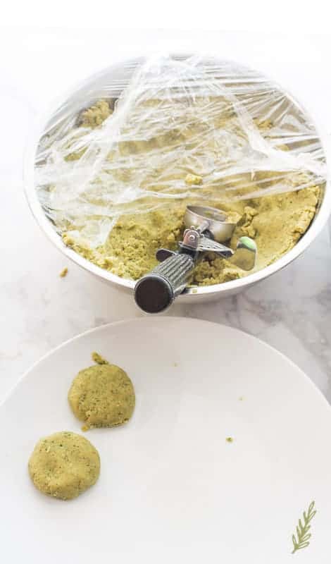 A portion scoop is used to form the Egyptian Falafel mixture into balls. 