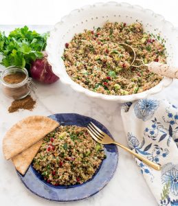 Tabbouleh portioned out and in a large serving bowl