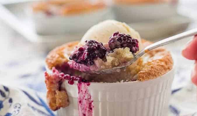 Scooping out Blackberry Cobbler with a spoon