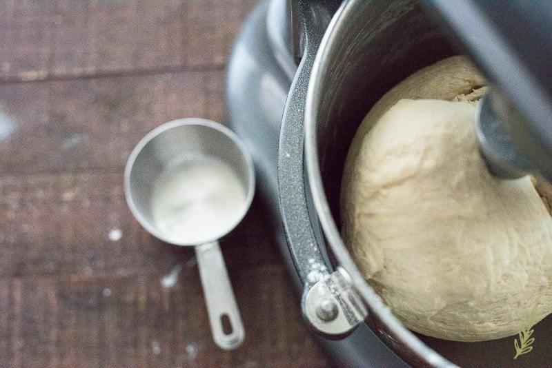 The final dough is tacky, but no longer sticky, and climbs up the dough hook