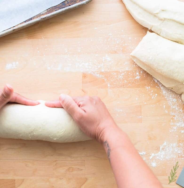 A hand forms the pan sobao loaves