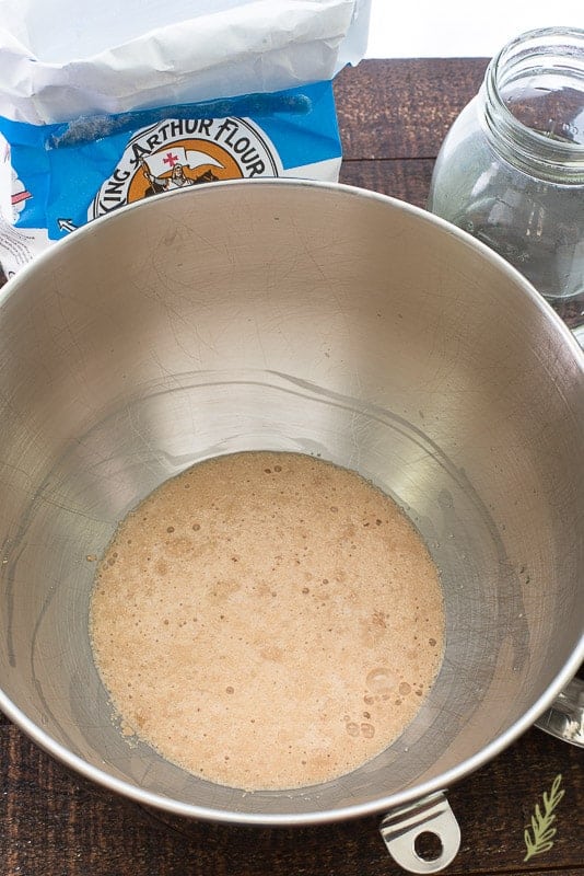 The yeast is allowed to bloom (bubble and foam) for 5 minutes in a mixing bowl