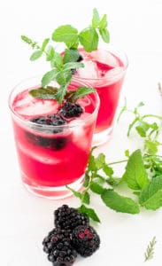 side view of two glasses of Blackberry Smash cocktails