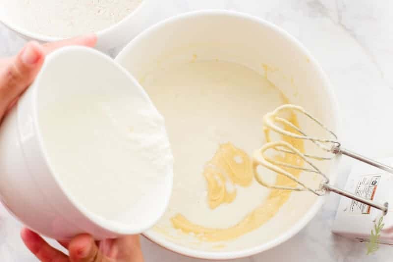 The wet ingredients are added to the mixing bowl after the dry ingredients were mixed in using a hand mixer. 