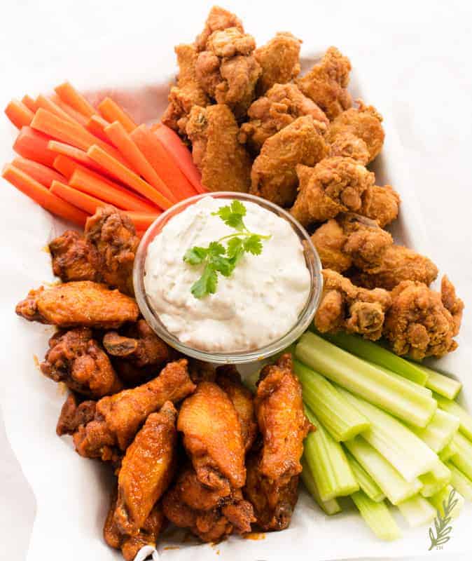 Overhead shot of a platter of Buffalo Wings with Blue Cheese Dip perfect for Labor Day meals