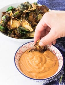 Dipping brussels sprouts into Gochujang Mayo