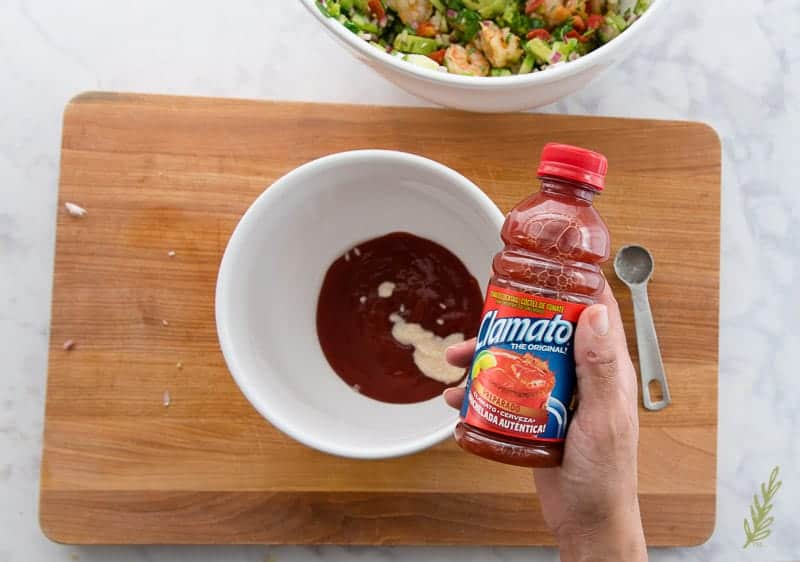 Showing Clamato which is added to Coctel de Camarones (Mexican Shrimp Cocktail) tomato sauce