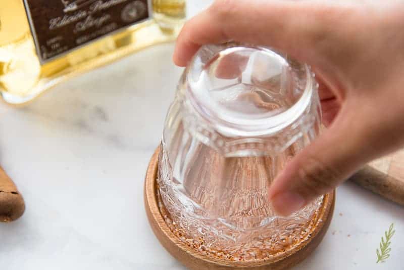 Rimming the cocktail glass with the smoked spice mixture