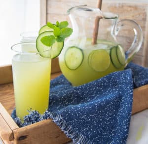 Cucumber-Lime Agua Fresca served on a tray with speckled blue towel