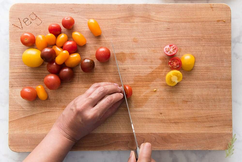 Slice the cherry tomatoes in half
