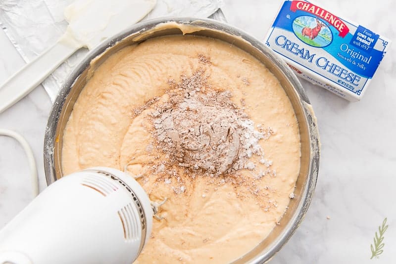 Add the cornstarch-spice mixture to the cheesecake filling