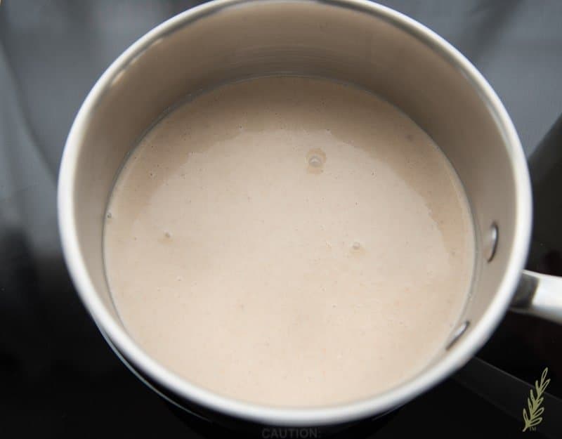 Gently heat the coquito to cook off the rum