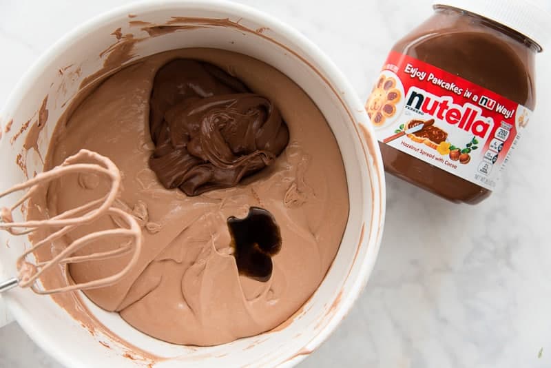 Adding the Nutella and vanilla to the chocolate cheesecake batter