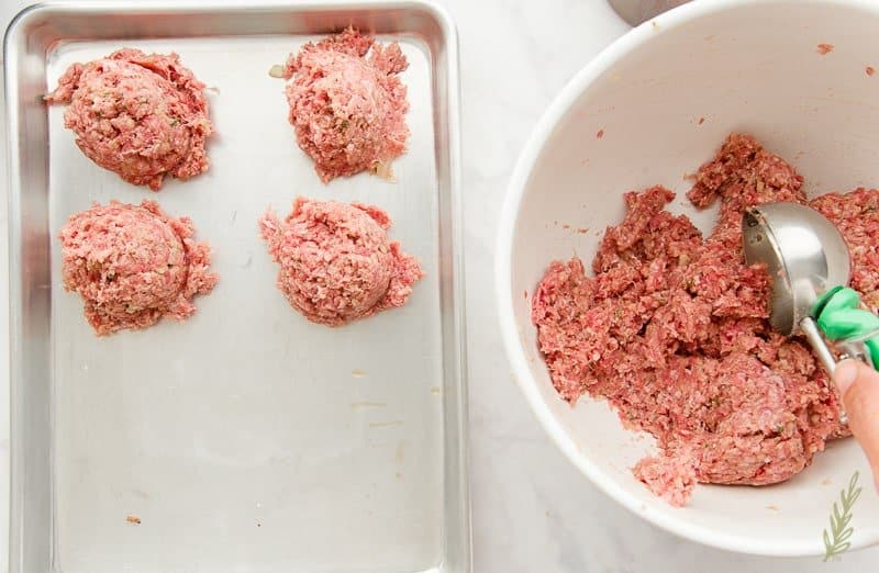 Scooping out accurate portions of the ground meat mixture using a portion scoop