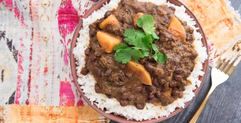 Enjoy a simple man's meal of Habichuelas Guisadas and steamed rice
