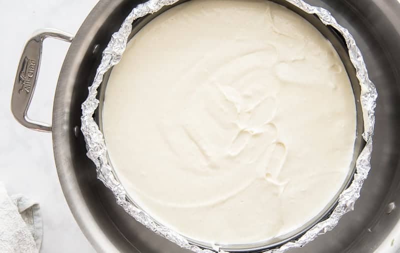 The Classic Cheesecake sits in a hot water bath prior to being baked