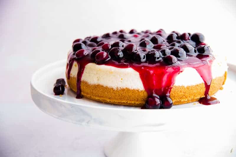 Classic Cheesecake with Graham Cracker Crust is topped with a blueberry filling