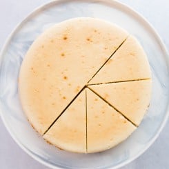 An overhead image of a sliced Classic Cheesecake