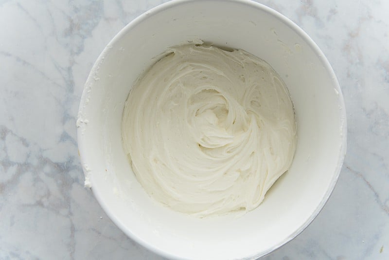 The finished Cream Cheese Frosting in a white bowl