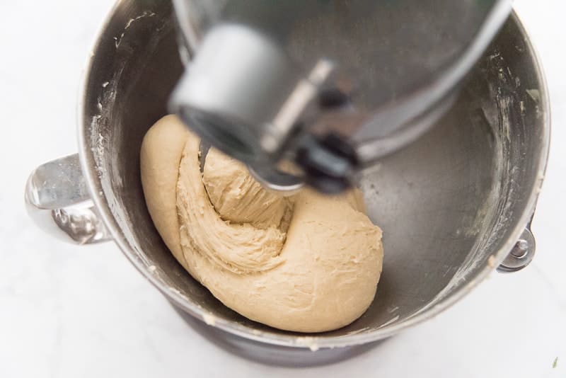 The finished dough is wrapped around a stand mixer's dough hook