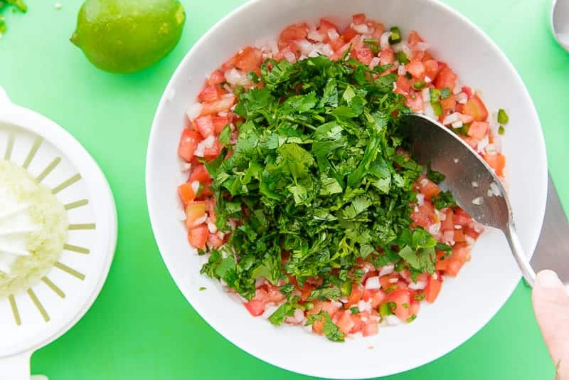 the pico de gallo is finished with a hefty amount of cilantro