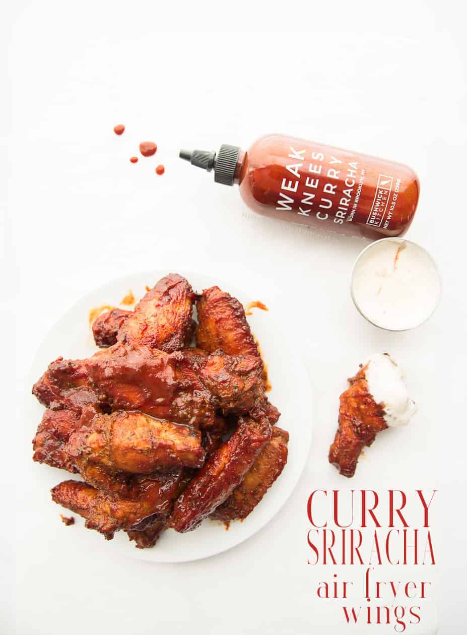 Curry Sriracha Air Fryer Wings will change everything you know about flavorful wings! Make these wings in less time (and oil) with more flavor than you knew was possible. #bushwickkitchen #currysriracha #chickenwings #wings #airfryer #airfryerrecipes #wingrecipe #currymarinade #curriedwings #jamaicancurry #srirachawings #gamedayrecipes #gamedayeats #appetizers #starters #chickenrecipes #cookingintheairfryer #dinner #lunch #easyrecipes #redstripe #weakknees #beesknees  via @ediblesense