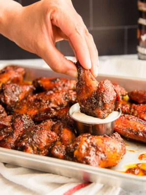 A preview of the Guava BBQ Air Fryer Wings shows a hand dipping a drumette into white dressing.