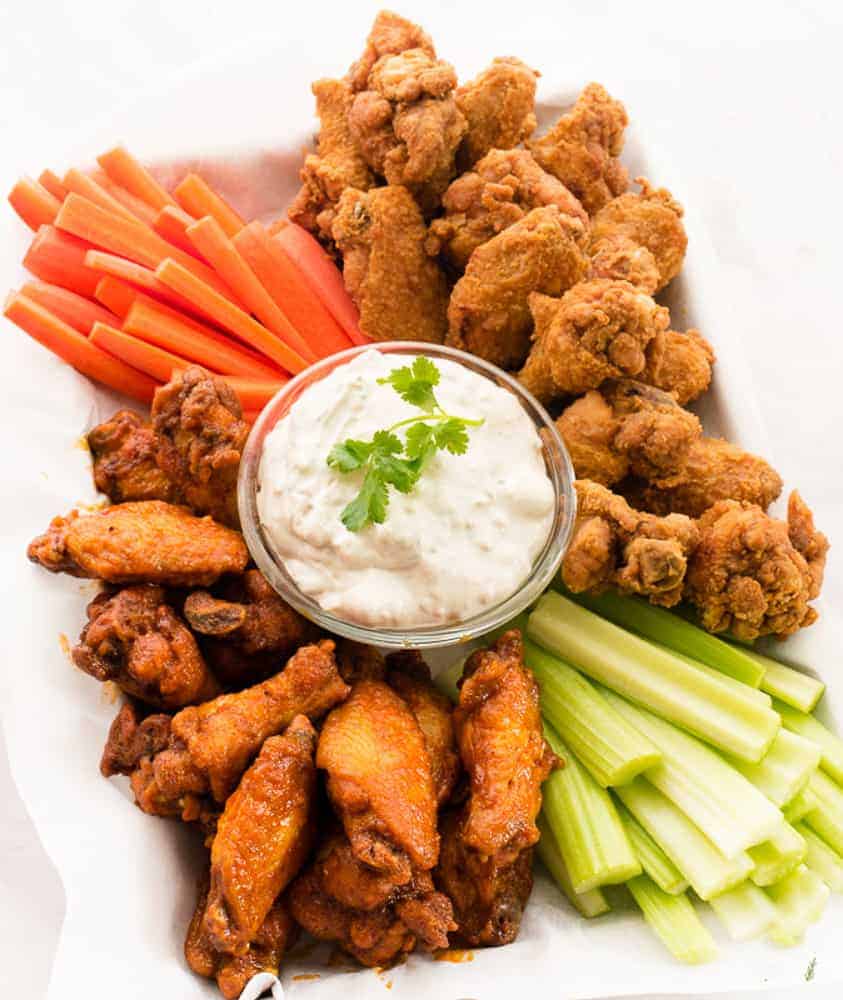 Lead post image of a Buffalo Wing Platter with carrots, celery and blue cheese dip in the center