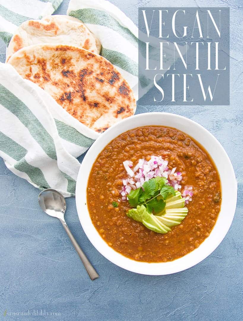 Settle in with a warmly spiced, bowl of comforting Vegan Lentil Stew. Made simply, yet filled with deep, rich flavors, it's a make-ahead dish that's also freezer-friendly. #lentilstew #veganrecipes #lentils #lentilrecipe #vegetarian #meatlessrecipes #stewrecipes #soups #glutenfree #highfiberecipe #onepotmeal #dal  via @ediblesense
