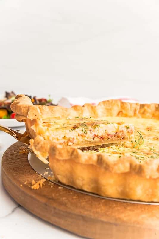 A slice of Quiche Lorraine lifted from the rest of the quiche