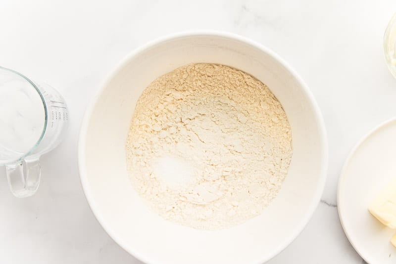 Flour and salt in a white ceramic bowl