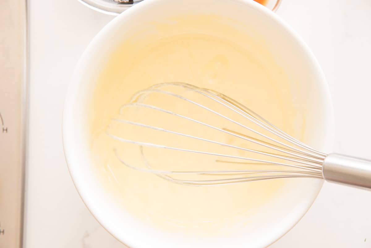 The egg yolks and sugar are whisked together until lemon-yellow in appearance.