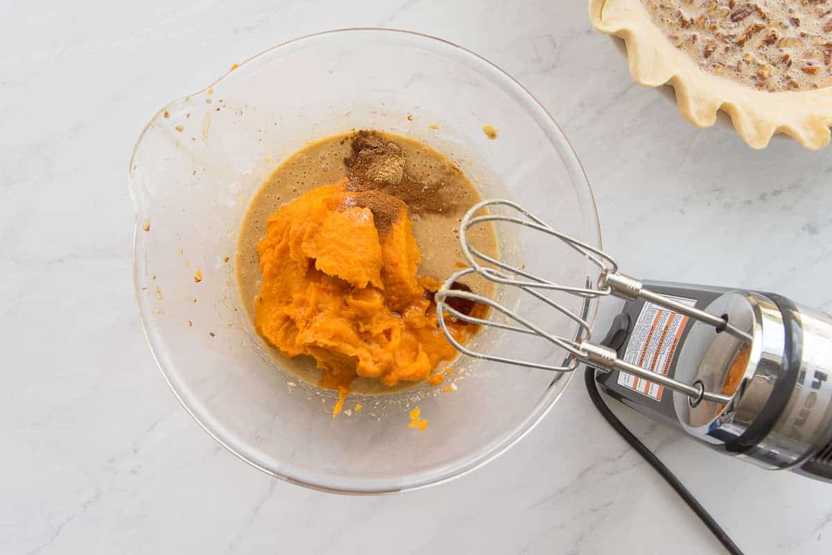 The sweet potato puree is added to the bowl with the egg mixture