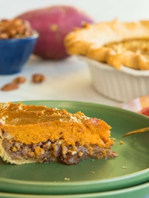 Preview image of a slice of Sweet Potato Maple Pecan Pie on a green plate. The rest of the pie is in the right background.