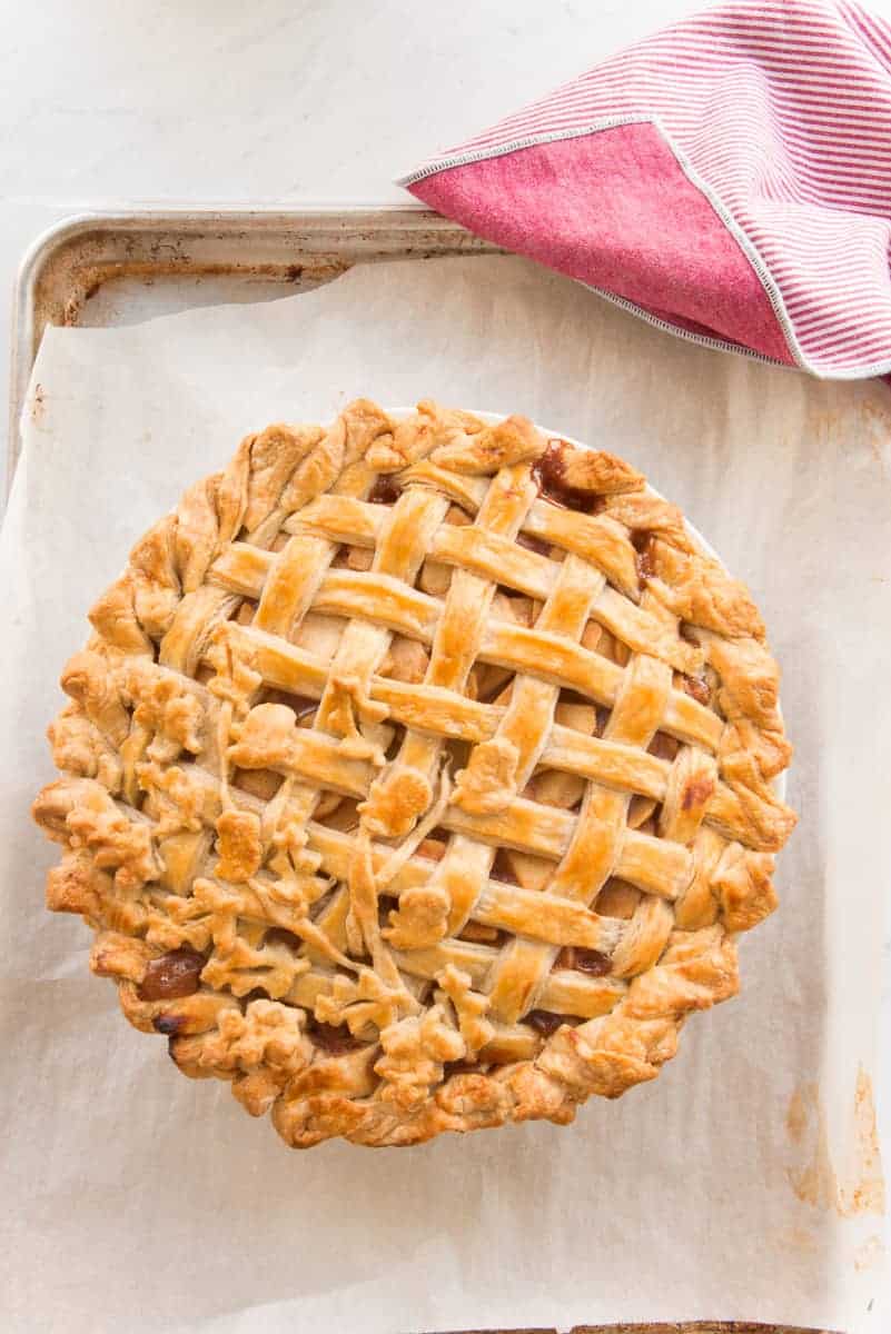 Overhead image of the baked Apple Cinnamon Pie with Lattice Crust on a parchment lined sheetpan
