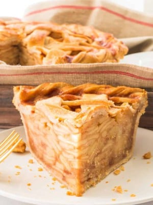 Social media image of a wedge of Apple Cinnamon Pie on a white plate.