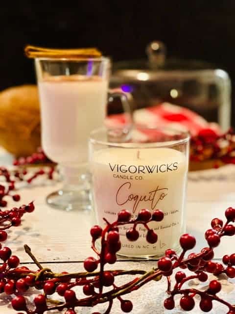 Vigorwick's Candle Co Coquito candle with festive backdrop for my 2021 Holiday Gift Guide