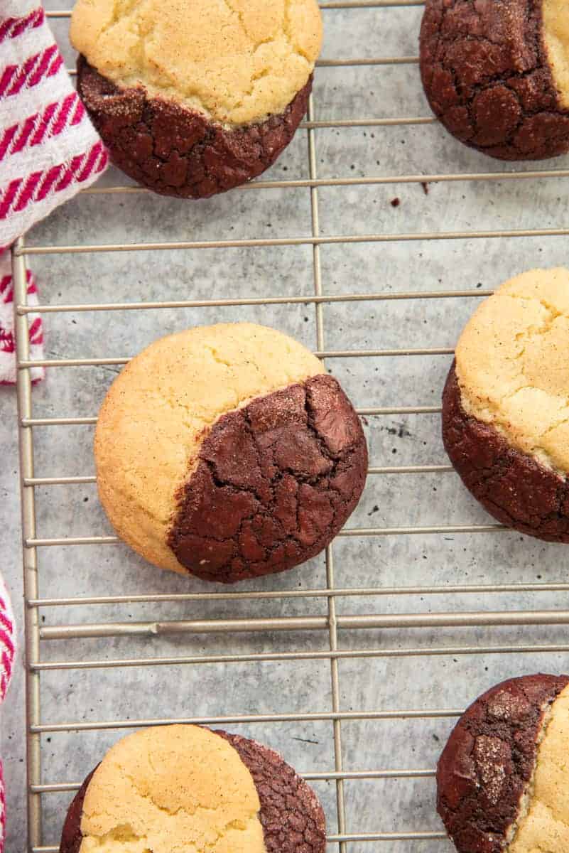 The Red Velvet Snickerdoodle Brookies are cooling on a silver cooling rack.