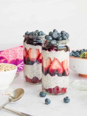 Preview image of two fruit parfaits surrounded by the recipe ingredients.