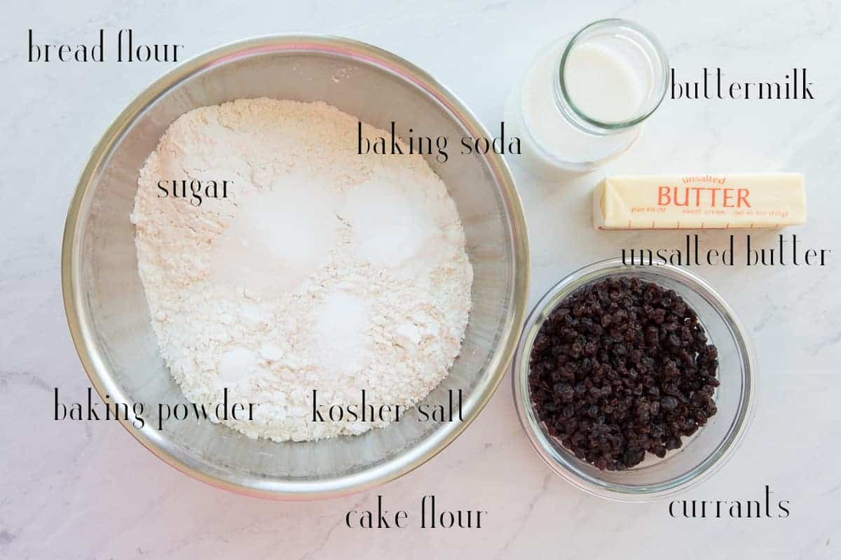 Ingredients needed to make Irish Soda Bread on a white surface.
