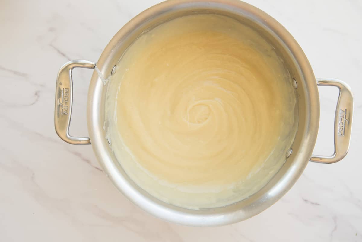 The finished custard in a silver pot.