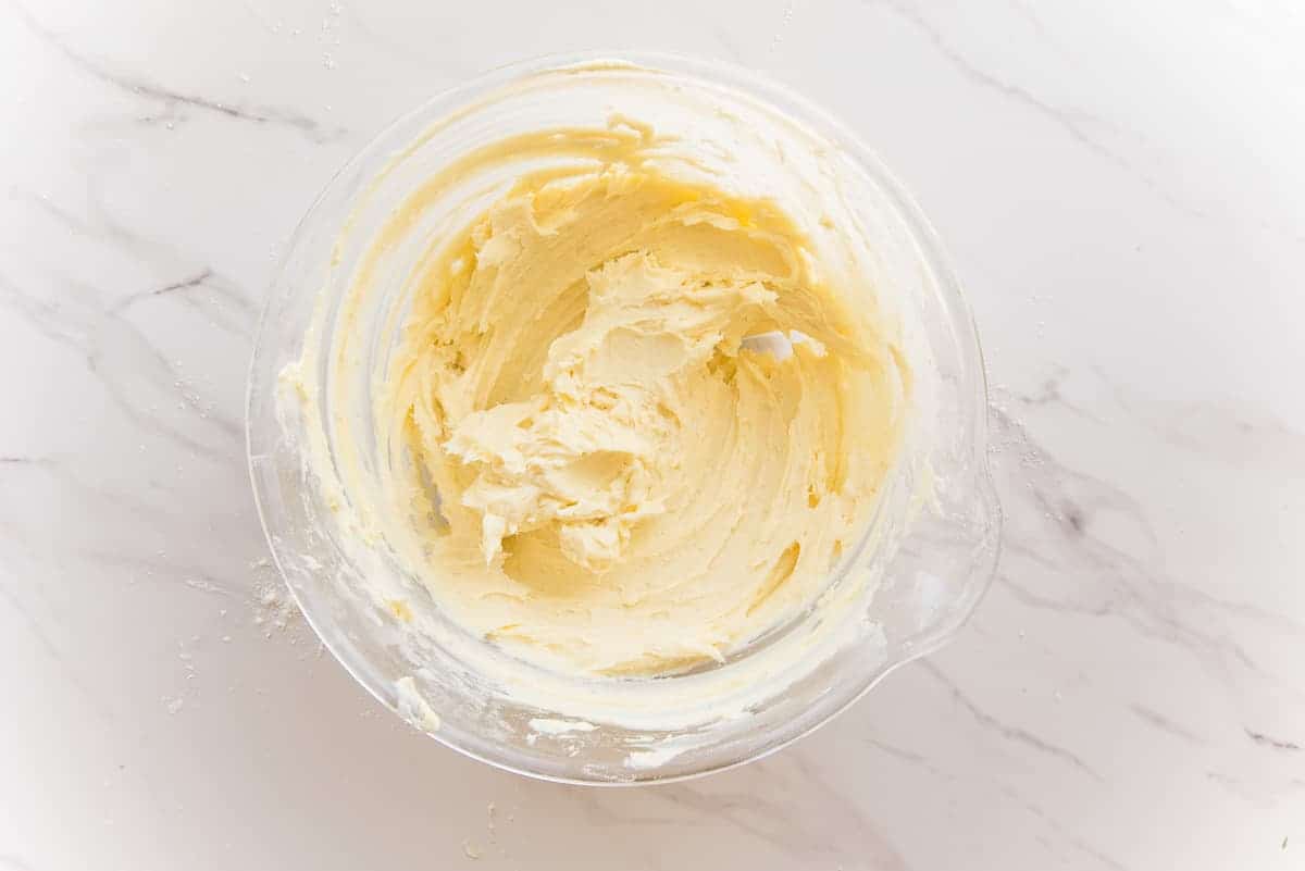 The butter mixture in a glass bowl reveals the finished consistency.