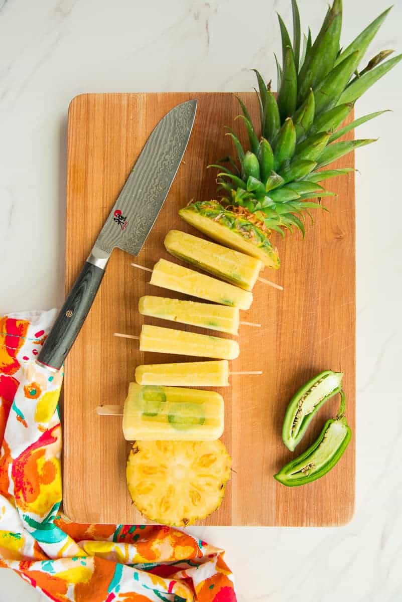 The top and bottom of a pineapple are separated by Spicy Pineapple Paletas