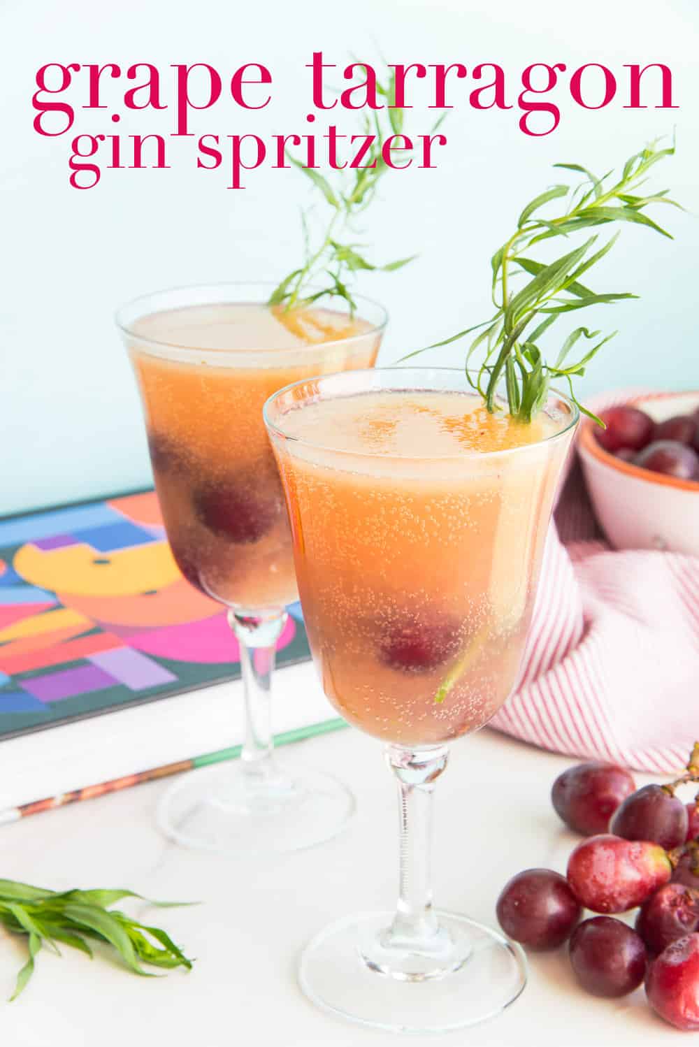This Grape Tarragon Gin Spritzer is inspired by Bryant Terry's refreshing grape tarragon mocktail. Made boozy with gin, this a great, fruity and herbaceous cocktail to serve at summer parties or at your next brunch. #grapedrink #gincocktail #ginspritzer #mocktail #tarragon #herbs #cocktails #party #cocktailparty #cocktailrecipe #drinkrecipe #Juneteenth #BlackFoodCookbook #eattheculture #JuneteenthCookout2022 via @ediblesense