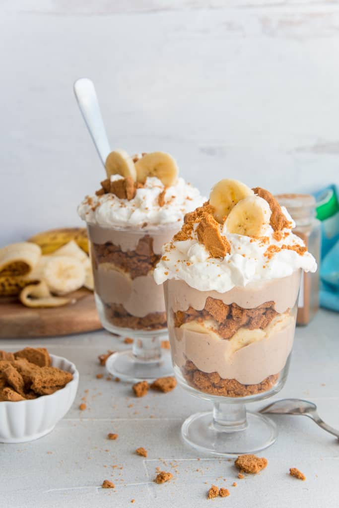 Two dessert glasses filled with Vegan Banana Pudding.