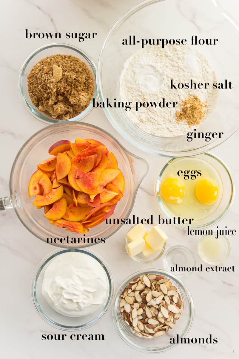 The ingredients to make the recipe are labeled and on a white countertop.