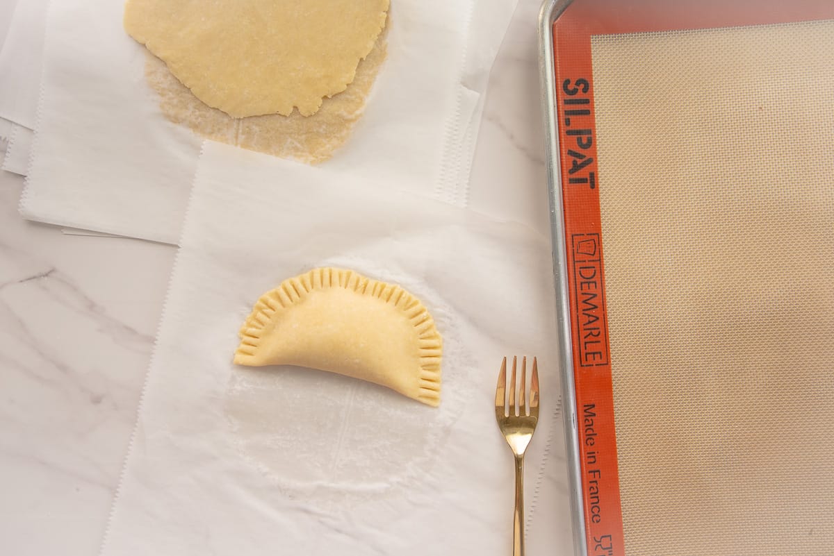 A fork is used to crimp the edges of the dough.