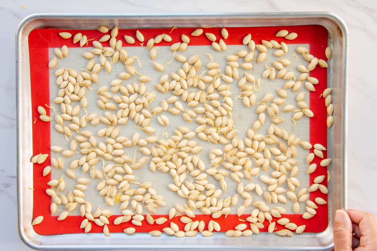 The cleaned seeds on a baking sheet.